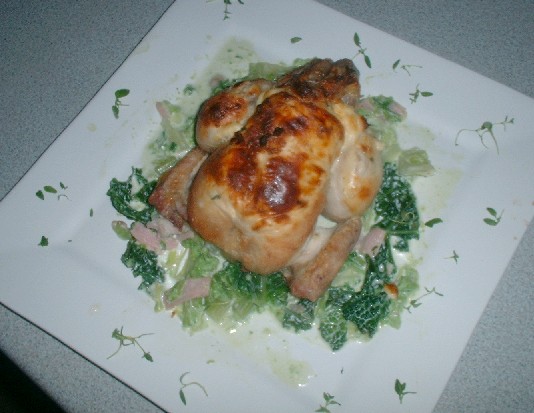 Poussin with cheese stuffed skin, creamed savoy cabbage