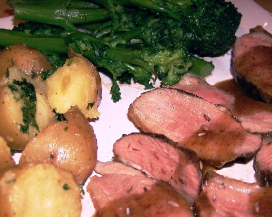 rare duck breast with lavender honey sauce, new potatoes and purple sprouting broccoli