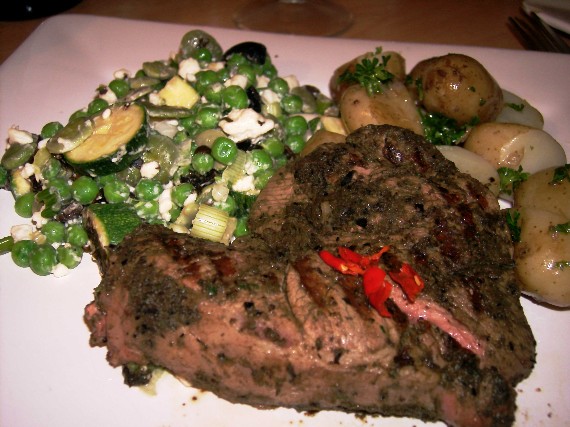 olive and basil crusted lamb leg steak with broad bean, feta and mint salad and jersey royals