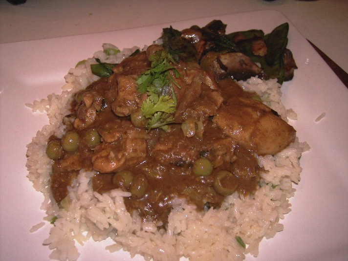 red chicken curry with small green eggplants