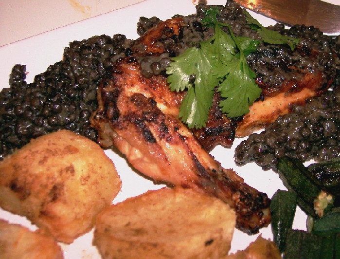 tandoori roast chicken with spiced potatoes and black lentil sauce